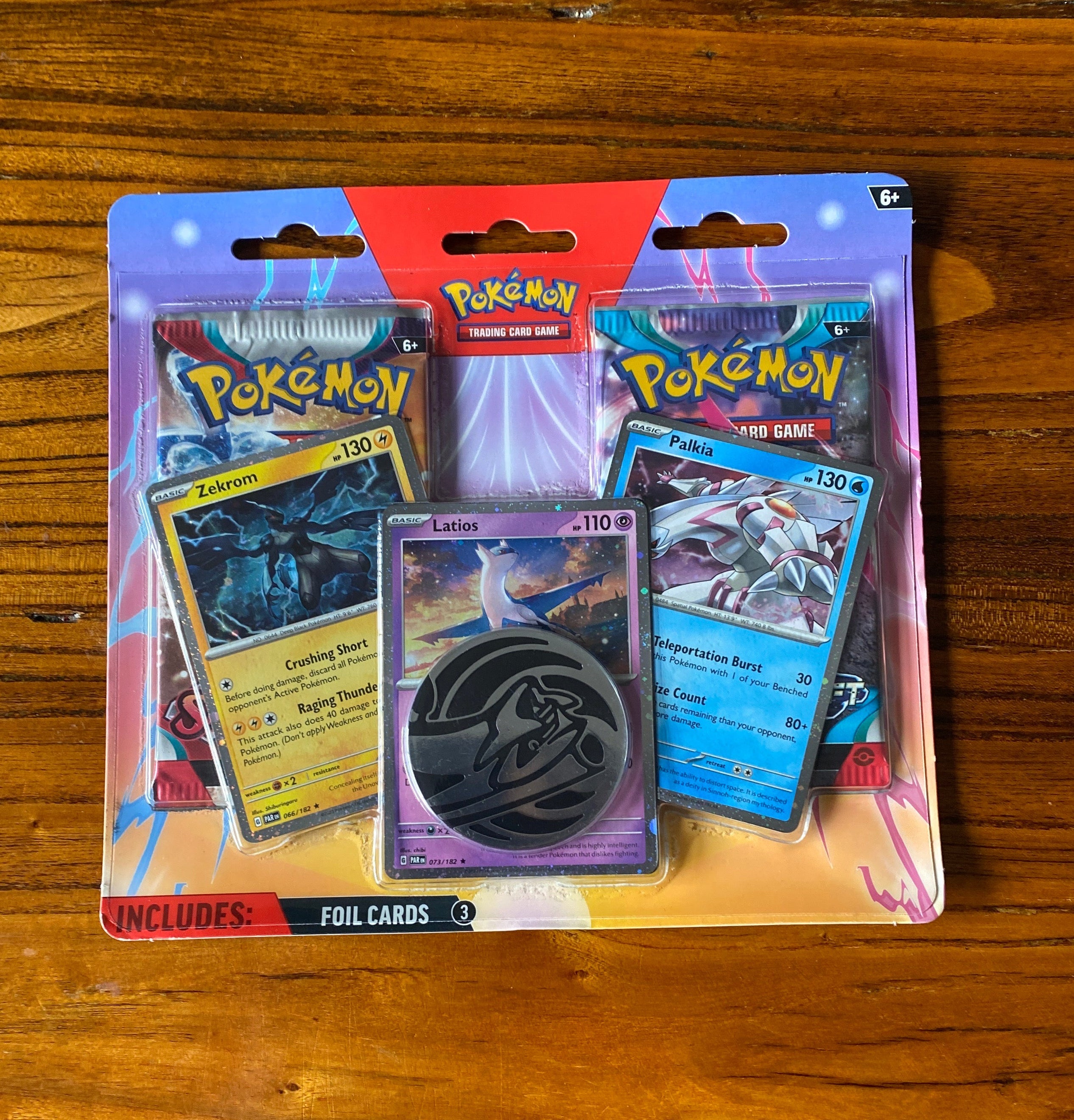 Pokémon TCG: Enhanced 2-Pack Blister featuring Latios, Zekrom, and Palkia. Includes: Three exclusive foil promo cards of Latios, Zekrom, and Palkia.
Two Pokémon TCG booster packs.
A collectible metallic Pokémon coin.
A code car